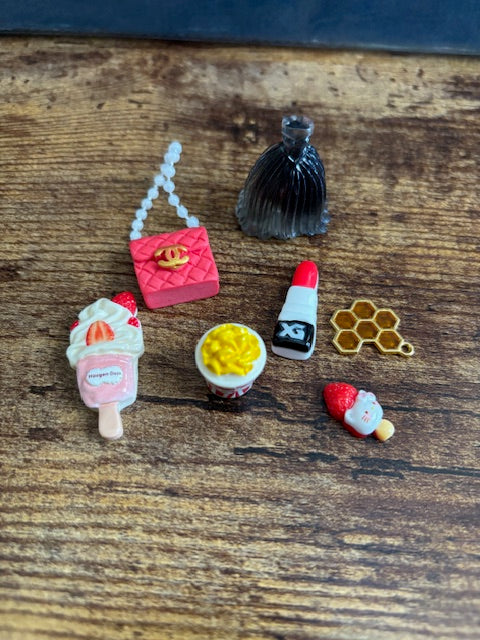 Collection of small decorative items on a wooden surface