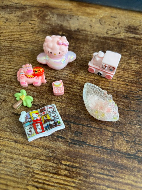Collection of small decorative items on a wooden surface